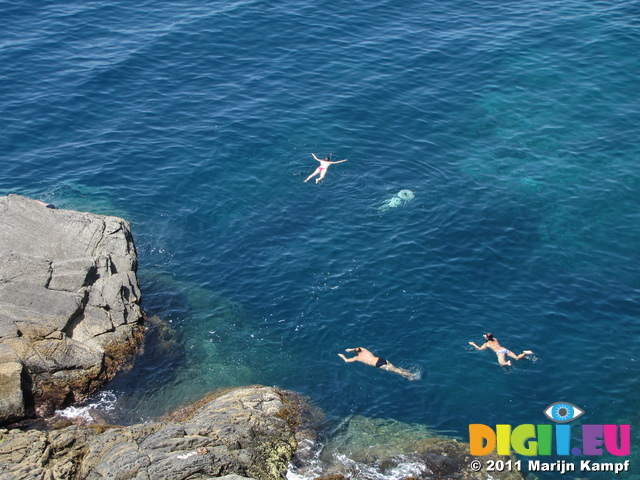 SX19547 People swimming by Cinque Terre Coastpath, Italy